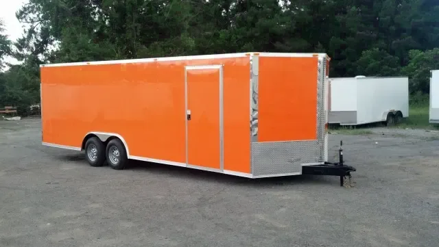 ORANGE 24FT ENCLOSED CAR HAULER WITH V-NOSE
