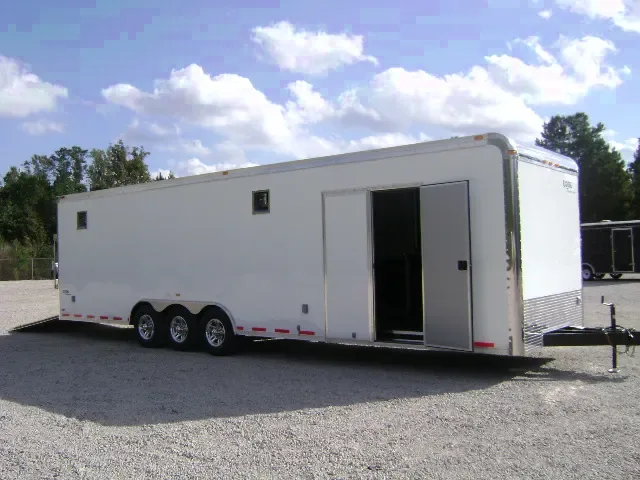 32FT LOADED CAR HAULER WITH CABINETS