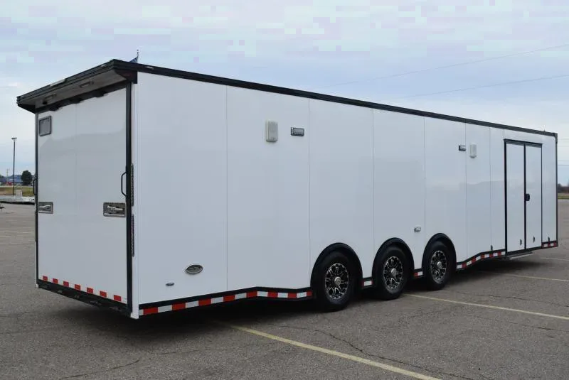 PRE-OWNED 2021 BRAVO 8.5x32' STP ENCLOSED RACE TRAILER w/ TRIPLE 6000# AXLES