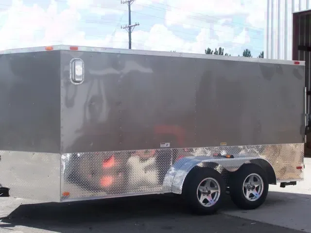 14ft T.A.  SILVER CARGO TRAILER WITH WRAP AROUND DIAMOND PLATING