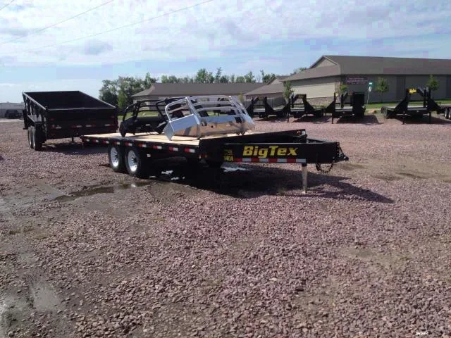 18ft flatbed 2-7000lb axles and slide in ramps