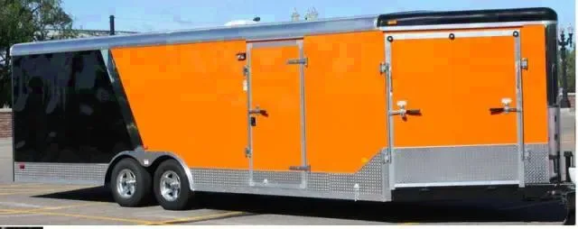 28FT ORANGE AND BLACK TA SNOWMOBILE/CAR HAULER