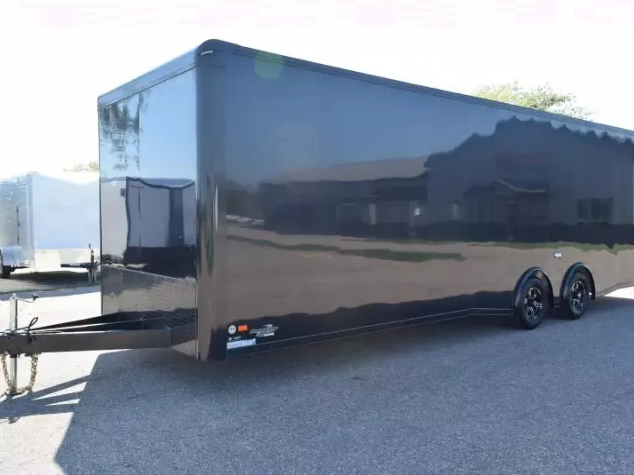 PRE-OWNED 2023 BRAVO 8.5x28 SILVER STAR ALUMINUM ENCLOSED CAR HAULER